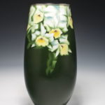green vase with white flowers