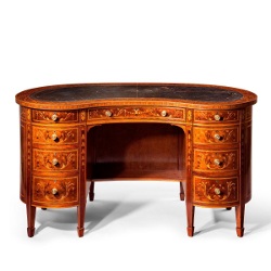 A fine free standing kidney shaped mahogany desk. C1900