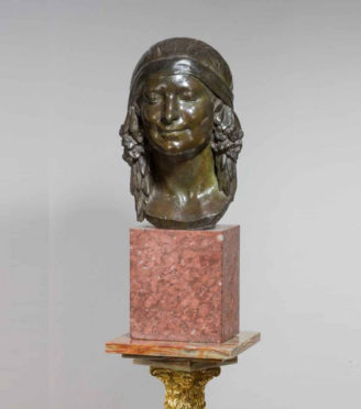 bronze women's face statue
