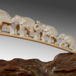 A Japanese ivory tusk carving of a group of elephants | Wick Antiques