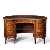 A fine free standing kidney shaped mahogany desk by Druce & Co, c1900