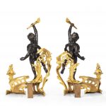 A pair of late 19th century ormolu and bronze chenets detail