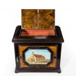 A fine quality ebony bijouterie table cabinet showing Cavalry Church, Stonington, Long Island