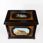 A fine quality ebony bijouterie table cabinet showing Cavalry Church, Stonington, Long Island top