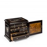 A fine quality ebony bijouterie table cabinet showing Cavalry Church, Stonington, Long Island drawers open