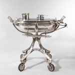 A large silver plate carving trolley or roast beef trolley by Erguis side facing