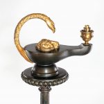 A cast iron colza style standard lamp