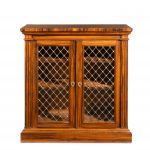 A late Regency Gonçalo Alves two-door side cabinet attributed to Gillows