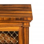 A late Regency Gonçalo Alves two-door side cabinet attributed to Gillows corner