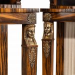 A pair of high Regency coromandel and ormolu bookcase console tables Egyptian gold face