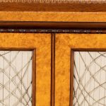 A Regency amboyna breakfront side cabinet closeup