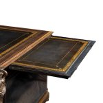 A large Napoleon III ebonized partners’ desk by Racault open