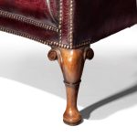 A Generous Leather Wing arm chair leg