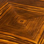 A stylish Art Deco zebra wood centre or dining table detail