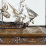 A silver and wood model of HMS Victory by H Wyllie front