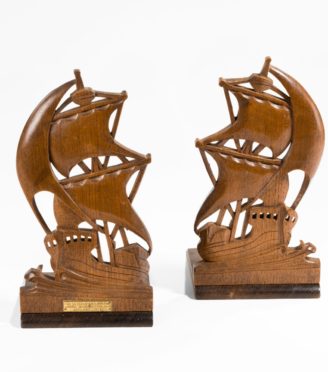 A pair of teak book ends from H MS Iron Duke