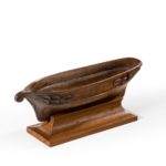 A mahogany miniature hull model of a galleon, on a mahogany stand. Late 19th century.