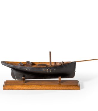 Victorian model of a racing yacht, with brass fittings, on a wooden stand original paint topsides English, c 1870.