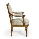 A pair of rosewood Louis XVI style open armchairs profile