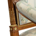 A pair of rosewood Louis XVI style open armchairs detail