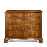A striking George III serpentine chest of drawers close up main