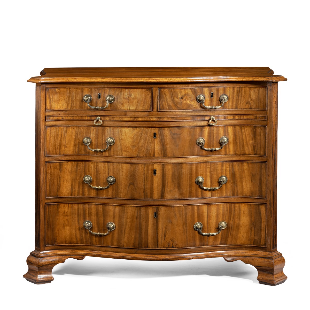 A striking George III serpentine chest of drawers close up main