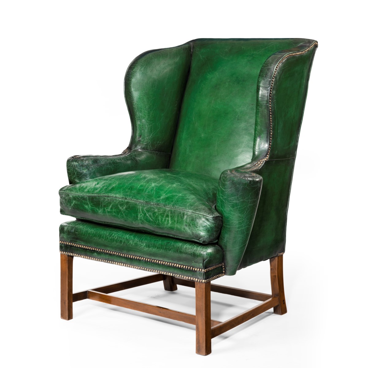 A III green leather wing arm chair Wick Antiques