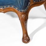 A pair of very generous mahogany wing armchairs attributed to Whytock and Reid leg