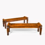 A pair of George III mahogany hall benches in the manner of Marsh & Tatham