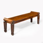A pair of George III mahogany hall benches