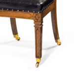 A set of six Gothic oak dining chairs leg detail