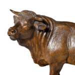 A fine 'Black Forest' linden wood model of a standing bull