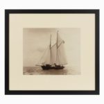 A rare early photographic print of the Schooner Cacouna tack in the Solent. She is flying the burgee of  the royal Thames yacht club  at the top of  her main mast. Signed in ink. Kirk Cowes.