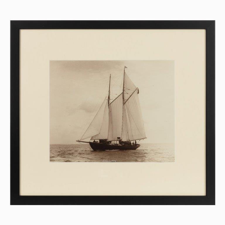 A rare early photographic print of the Schooner Cacouna tack in the Solent. She is flying the burgee of  the royal Thames yacht club  at the top of  her main mast. Signed in ink. Kirk Cowes.