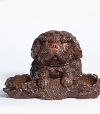 A ‘Black Forest’ walnut tobacco box in the form of a long-haired dog