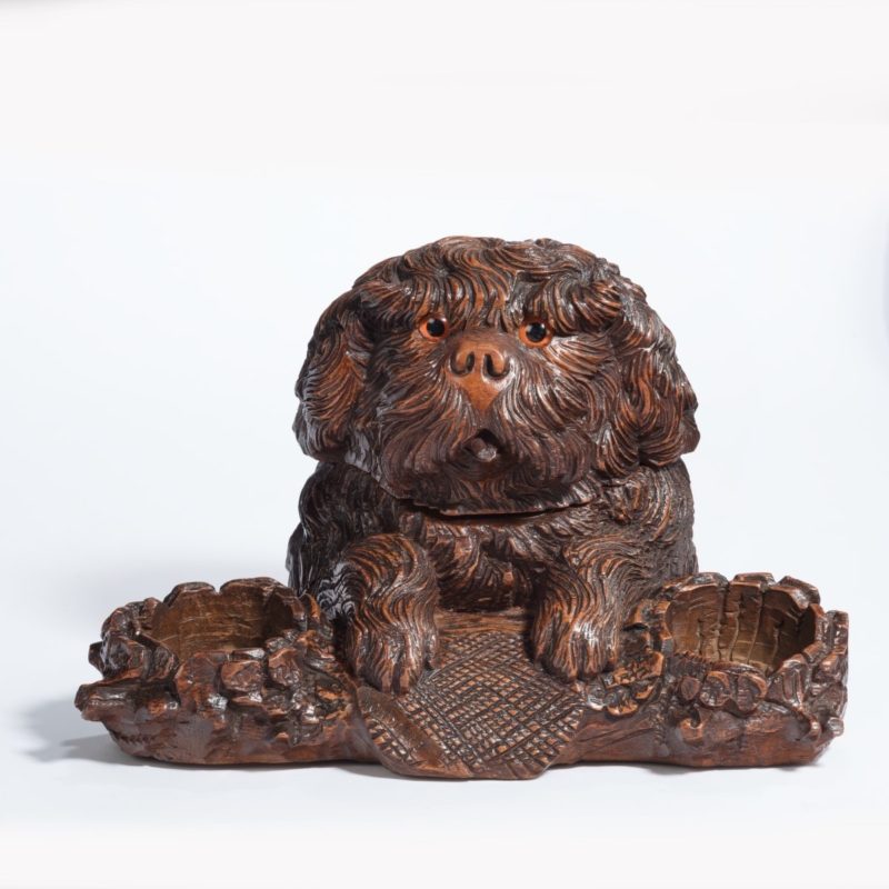 A ‘Black Forest’ walnut tobacco box in the form of a long-haired dog