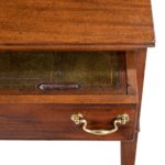 A George III free-standing mahogany architect’s desk drawer open