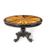 A large Anglo-Ceylonese ebony and specimen wood centre table circa 1840