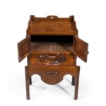 A George III mahogany tray top commode from the Chippendale period open