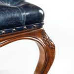 A mid-Victorian walnut stool leg detail