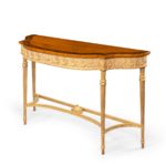 A pair of Victorian Hepplewhite style satinwood console tables side view