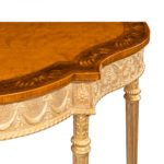 A pair of Victorian Hepplewhite style satinwood console tables gold table legs