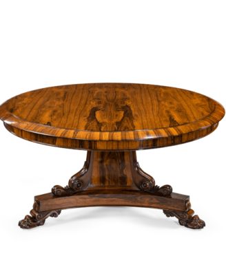 A Regency figured rosewood tilt-top centre table