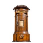 A Victorian oak country house letterbox by Rodrigues, dated 1872,