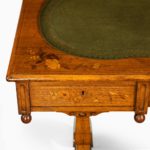 A Victorian walnut marquetry writing table corner