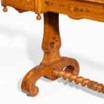 A Victorian walnut marquetry writing table attributed to Edward Holmes Baldock leg details