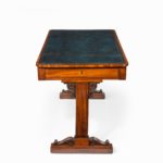 A Regency mahogany end support library table side