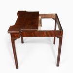 George III mahogany and plum pudding mahogany concertina action card table closed extended
