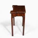 George III mahogany and plum pudding mahogany concertina action card table closed side