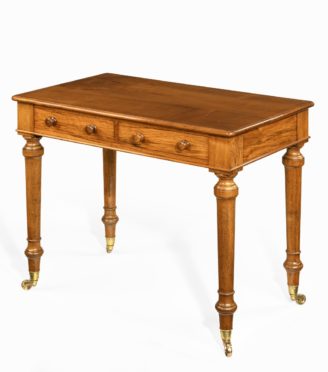 A mid-Victorian free-standing walnut writing table by Holland and Sons